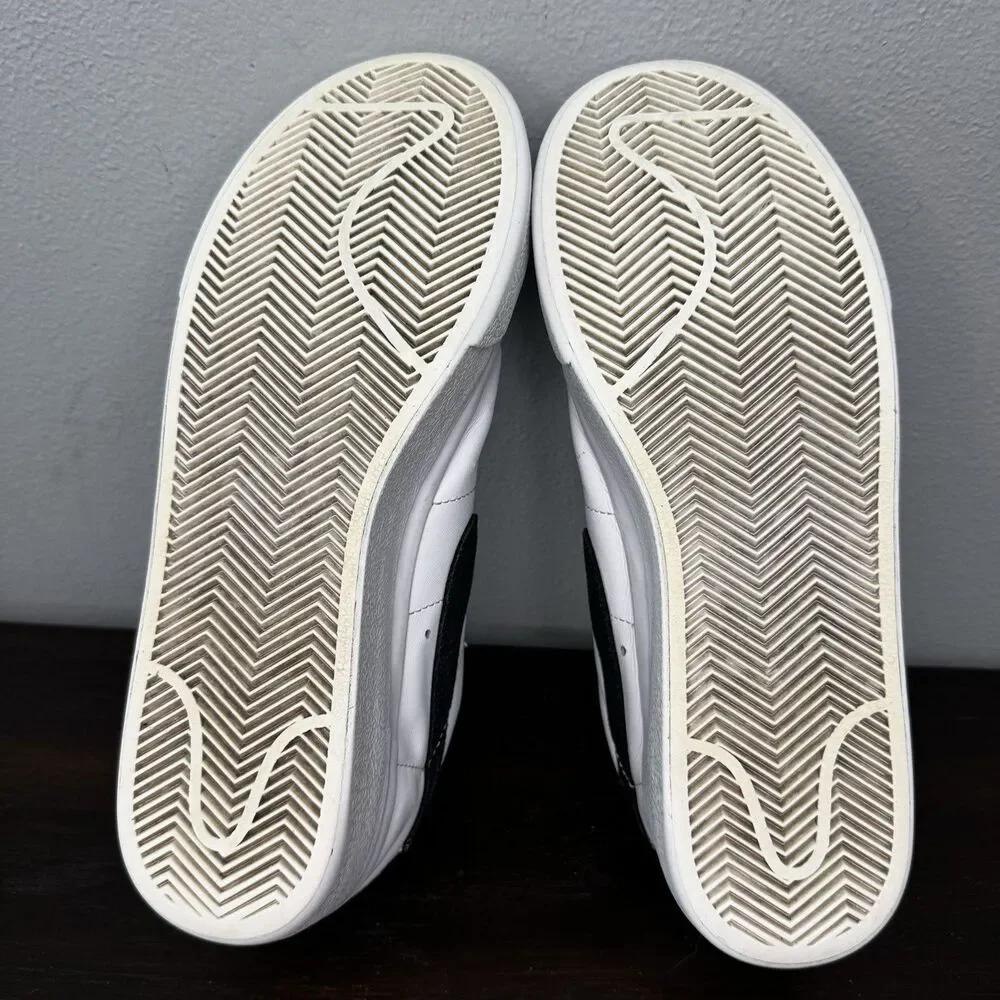 Nike White Leather Low-Top Sneakers with Black Swoosh and Yellow Tongue